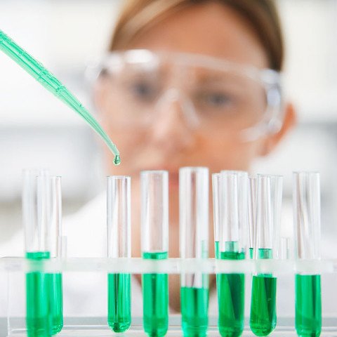 Lab Technician Using Pipette