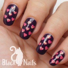 Pink Heart Pattern on Purple Nail Design